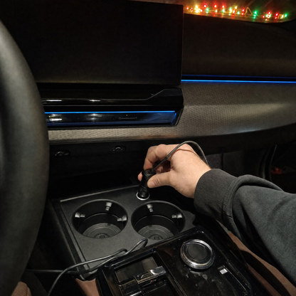 Plugging the lights into the car's 12V socket with a USB adapter